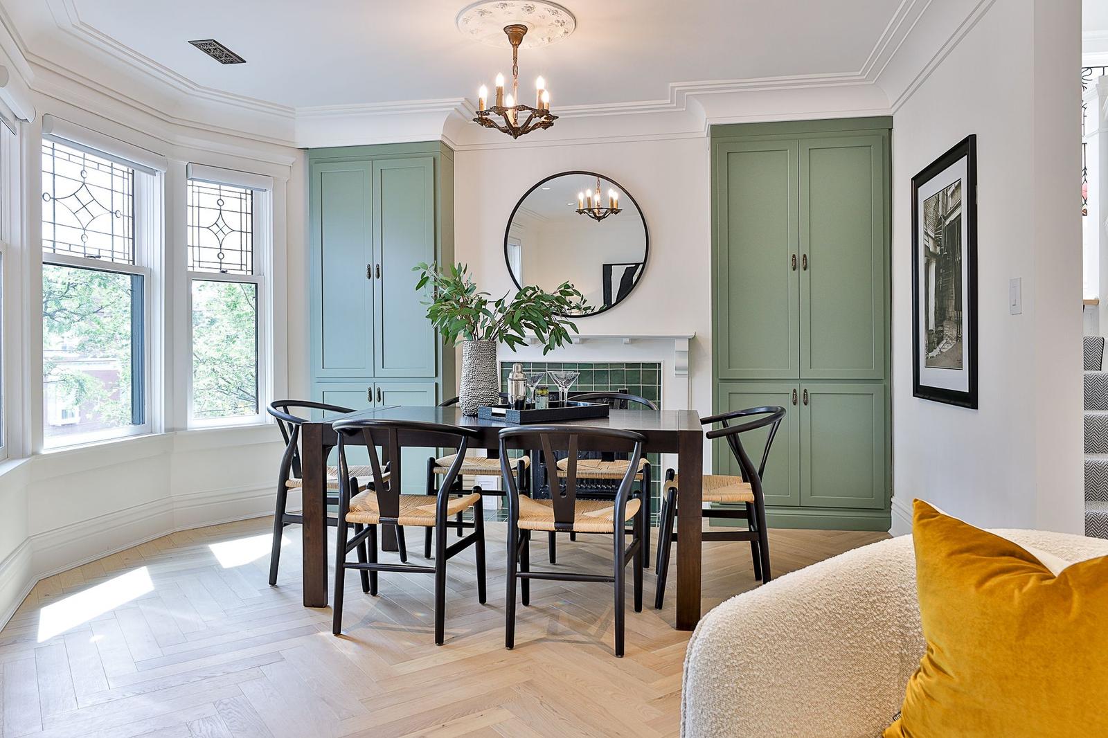 Dining room with fireplace and built-in cabinetry